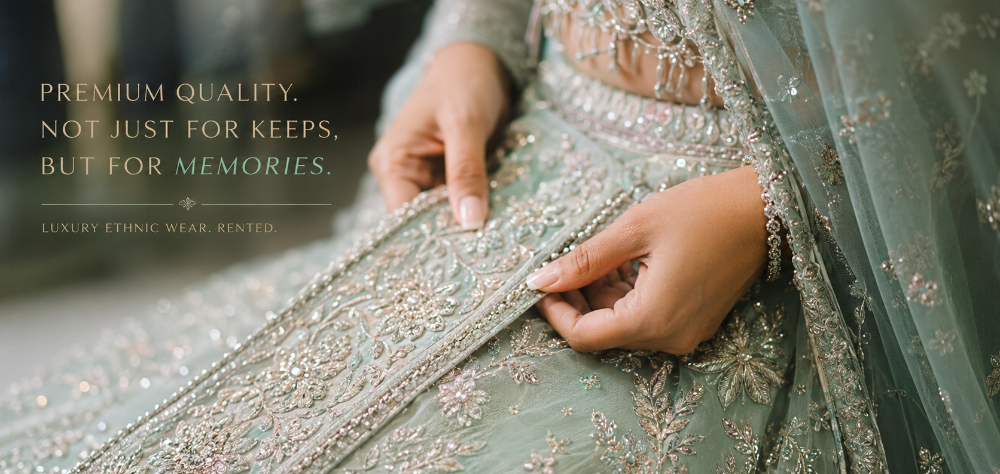  Close up detail of intricate silver zari embroidery on a premium rented lehenga