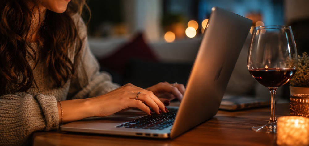 Woman excitedly browsing options for her first wedding guest outfit rental